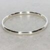 Sara Curved Silver Bangle Heidi Kjeldsen Jewellers BL1407 still