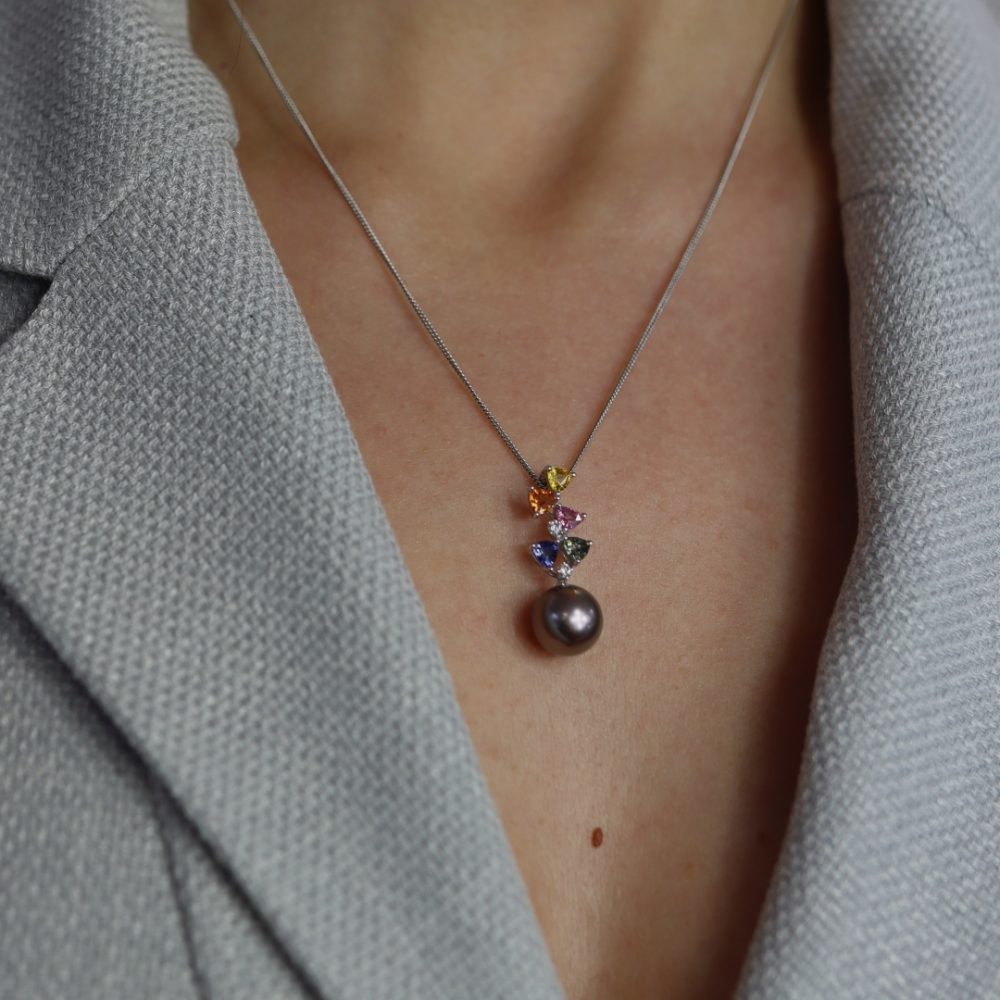 A cascade of rainbow colours of Sapphires, Diamonds and a beautiful Tahitian Pearl (approx. 11mm) make an irresistible pendant all made in 18ct white gold model