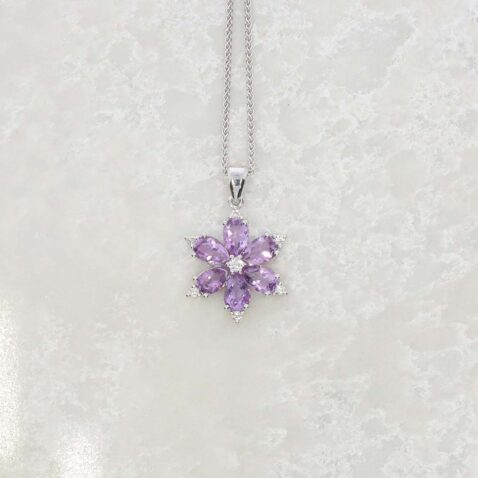 A sparkling Amethyst (approx. 1.98cts) and Diamond (approx. 0.10cts) star pendant made in 9ct white Gold makes a wonderful statement still