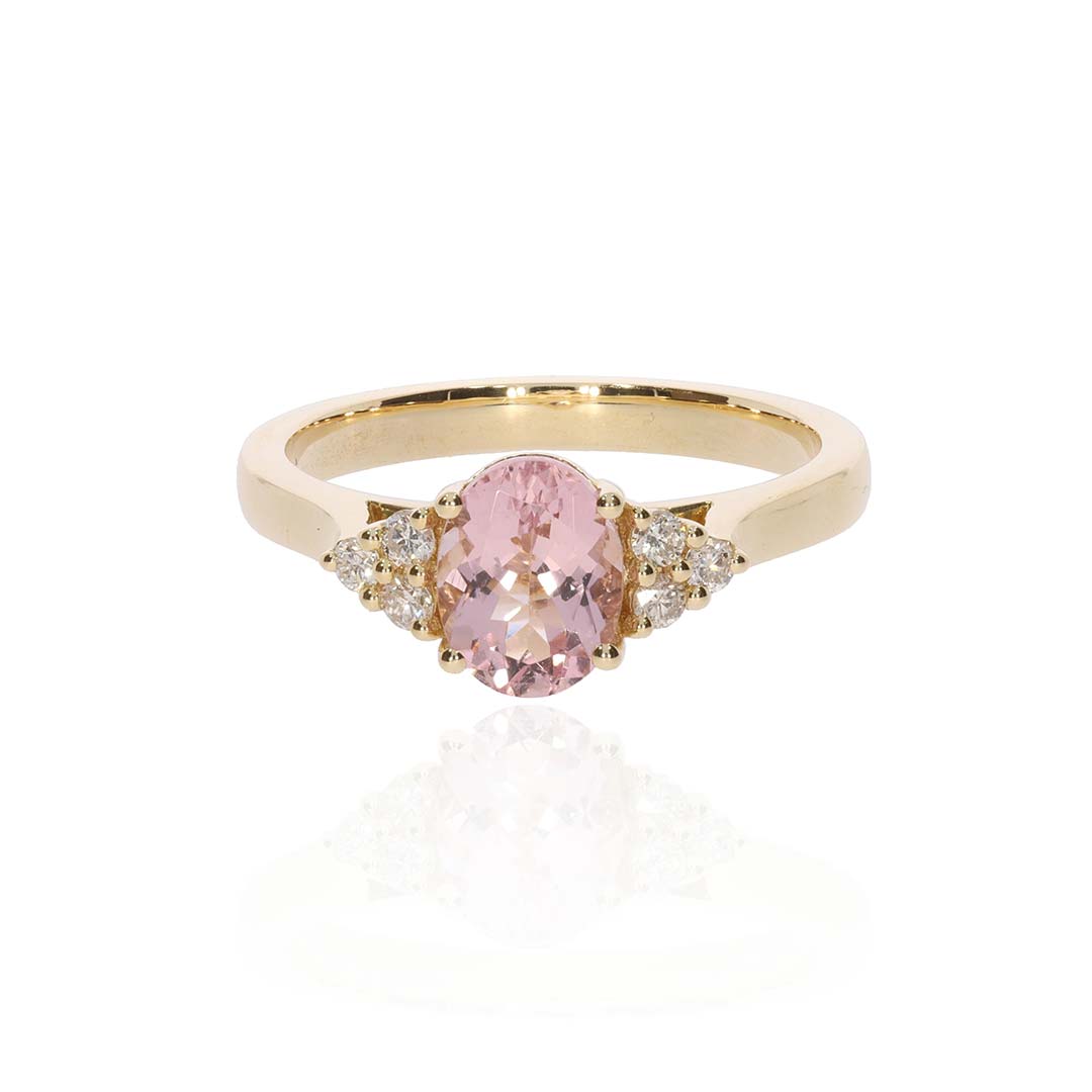A delightful Morganite oval (approx. 8x6mm, 1.14cts) and brilliant cut Diamond (approx. 0.15cts x6) 18ct yellow Gold claw set ring.